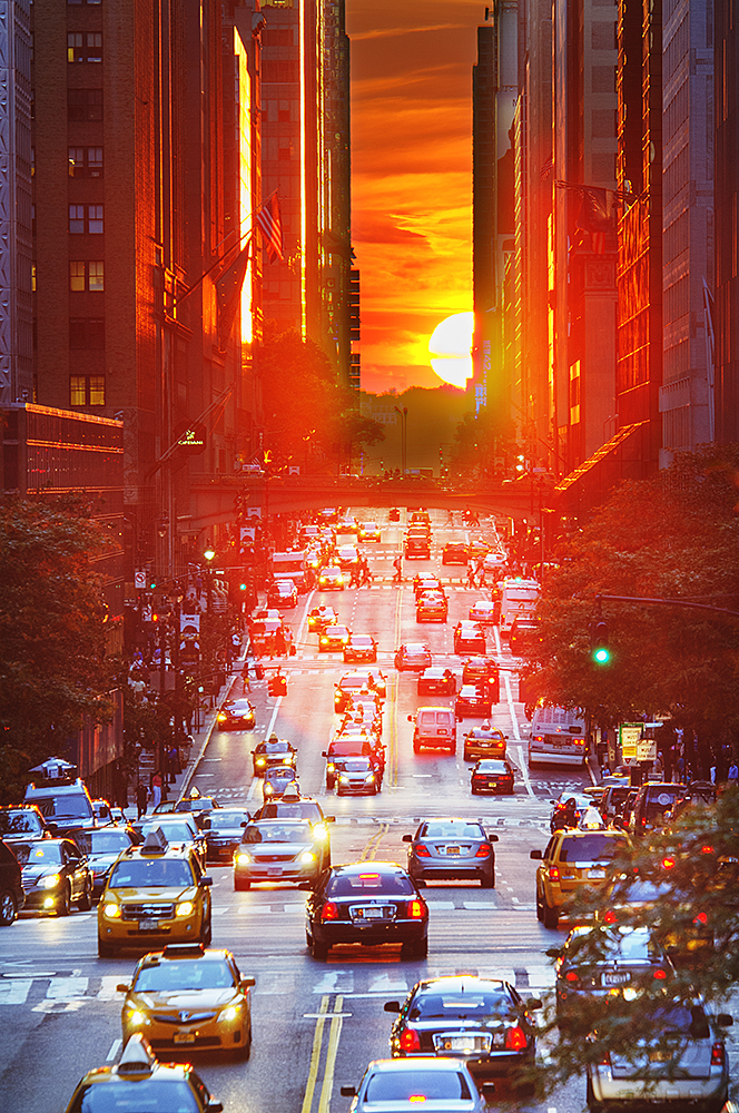 'Manhattanhenge Sunset On 42nd Street' by mitchell funk Photography